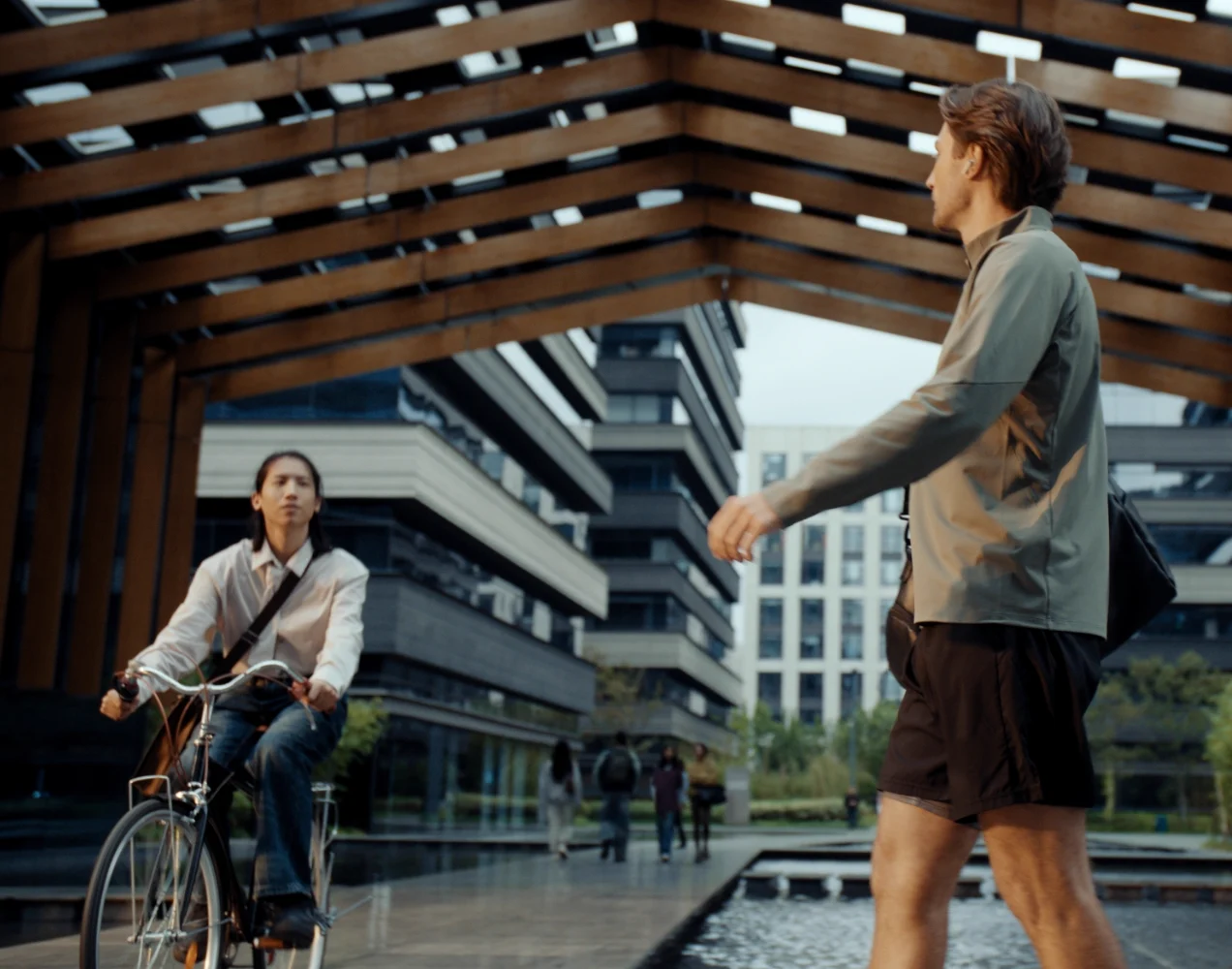 A cyclist and a pedestrian on the street