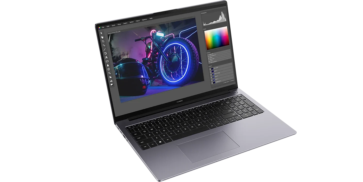 The laptop running a photo editor
